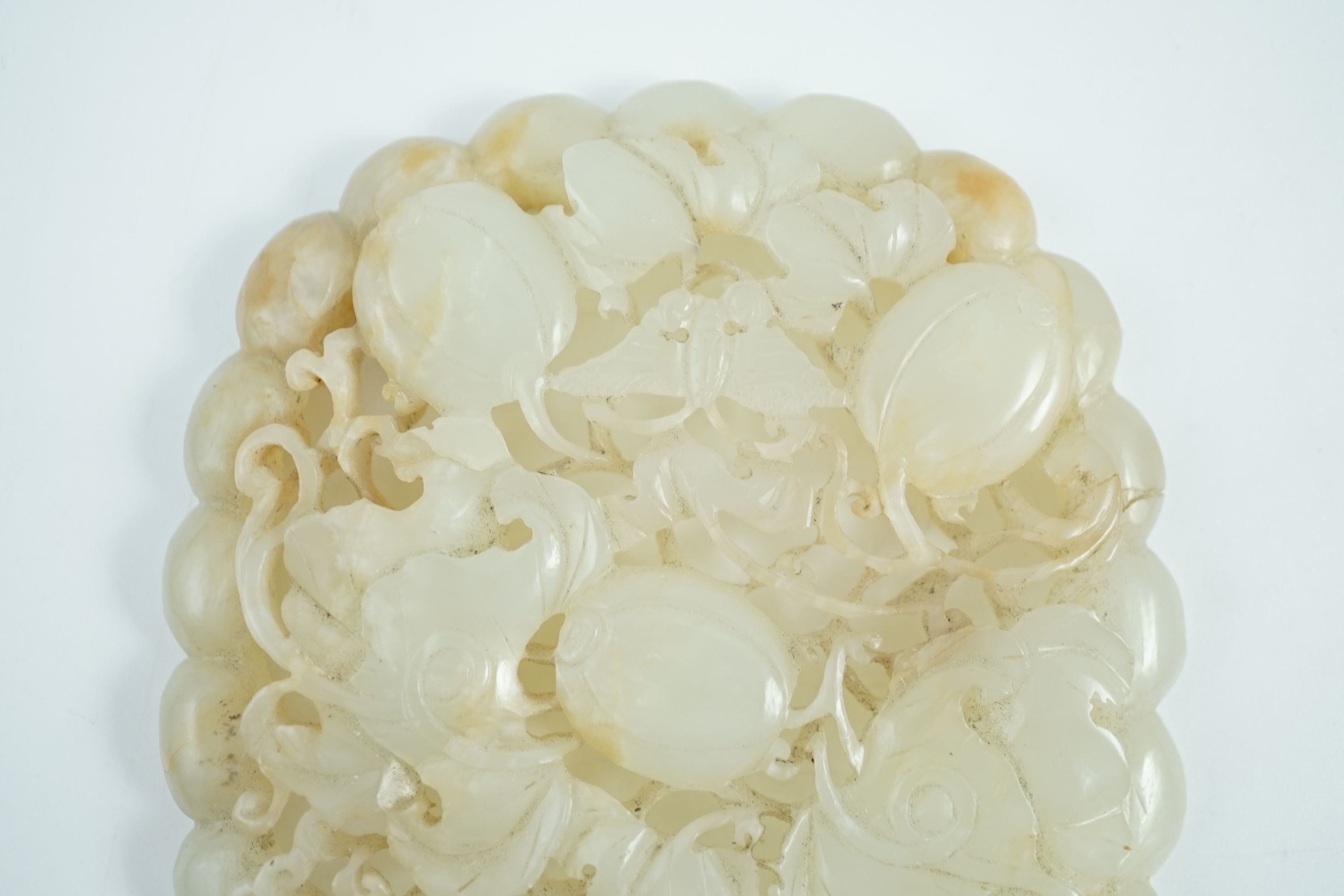 A Chinese pale celadon jade oval openwork plaque, 19th century, 9.8 cm x 8.2 cm